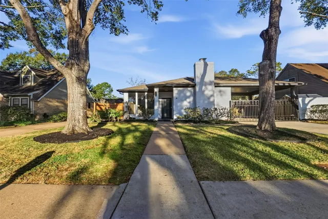 a view of a house with swimming pool