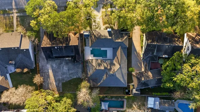 an aerial view of a house with swimming pool