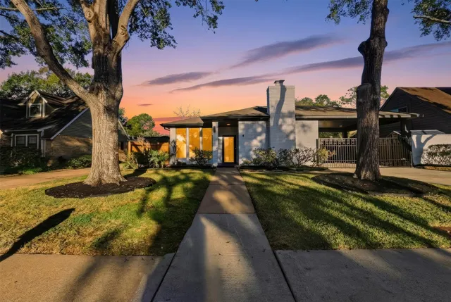 a view of a house with swimming pool