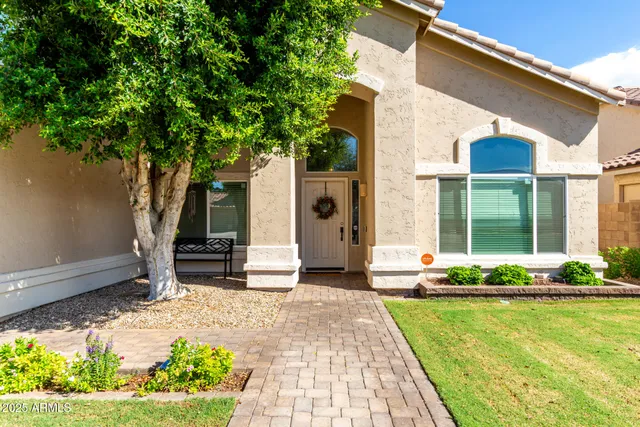 a front view of a house with a swimming pool