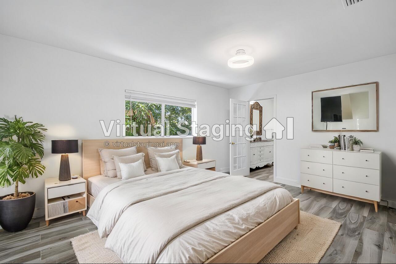 1641 Northwest 9th Street Boca Raton, FL 33486 - Photo 16 of 29 a bedroom with furniture and a large window
