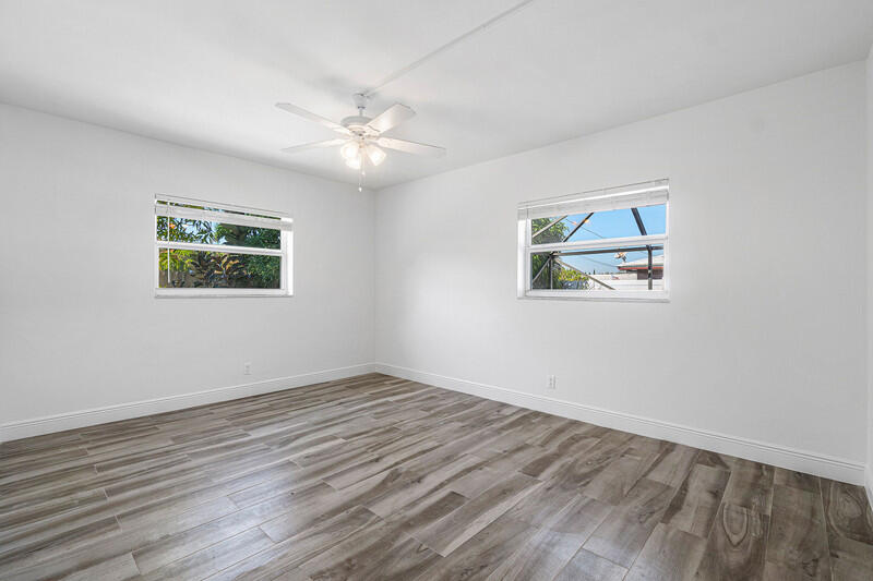1641 Northwest 9th Street Boca Raton, FL 33486 - Photo 20 of 29 a view of empty room with wooden floor and window