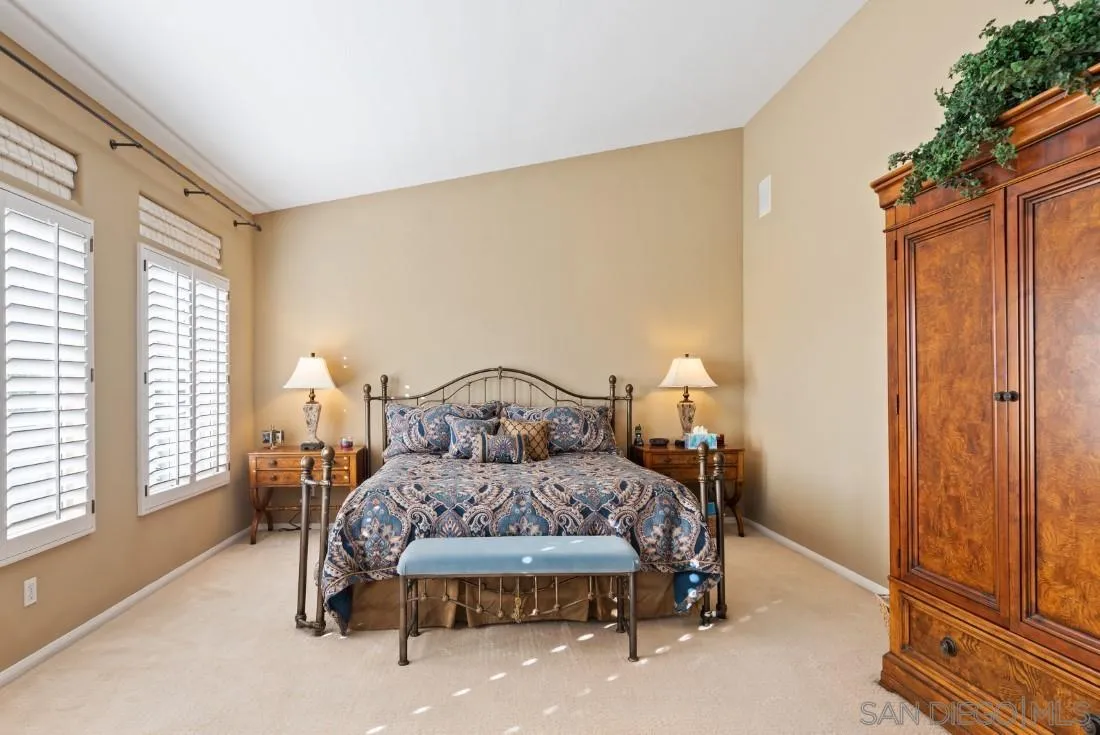 14268 Silver Ridge Road Poway, CA 92064 - Photo 42 of 53 a bedroom with a bed chair and a window