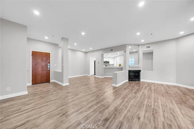 a view of kitchen livingroom with wooden floor