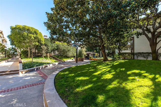 a view of a street with a building and a street sign