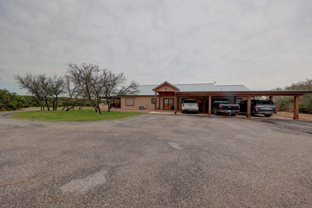 8177 Wendel Road Harper, TX 78631 - Photo 21 of 32 a view of house with outdoor space and car parked
