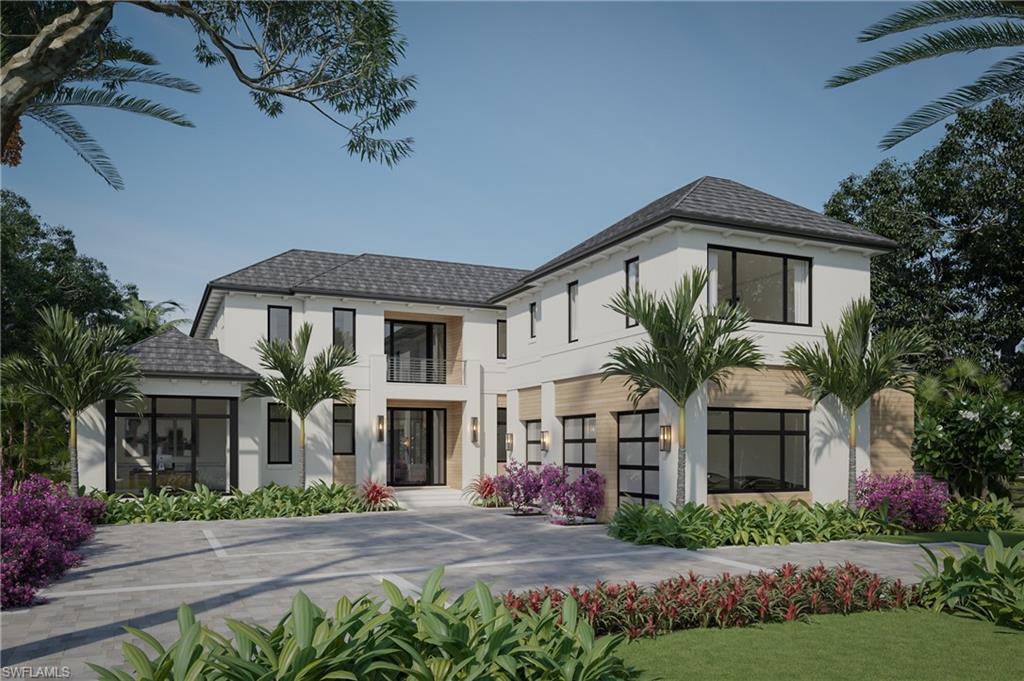 3240 Gin Lane Naples, FL 34102 - Photo 1 of 12 a front view of a house with a yard and garage