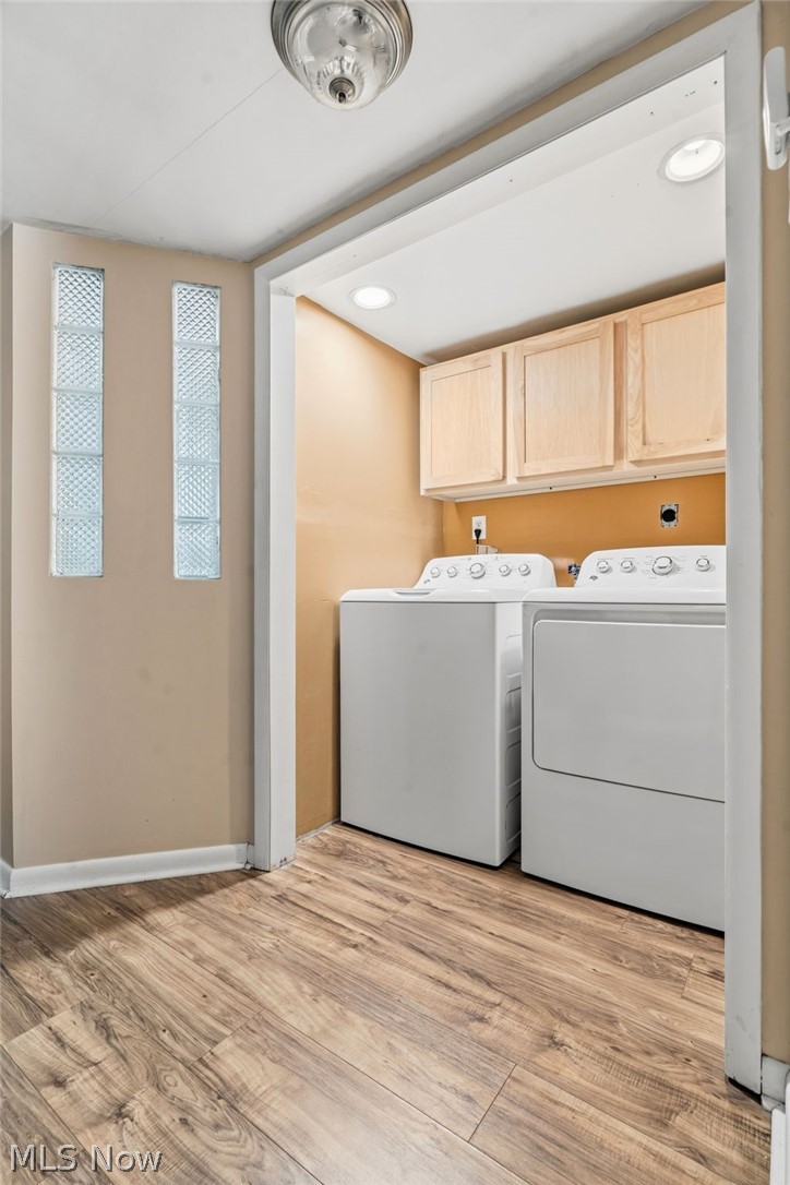 4449 18th Street Northwest Canton, OH 44708 - Photo 18 of 25 Dedicated laundry area featuring wood-finish flooring, two upper cabinetry units, and recessed lighting