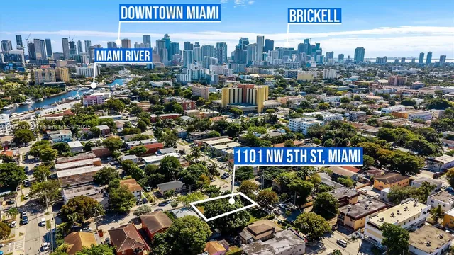 a view of a city with lots of plants and trees