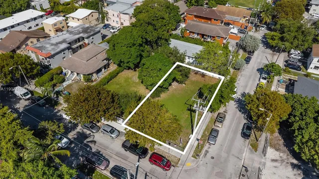 an aerial view of house with yard