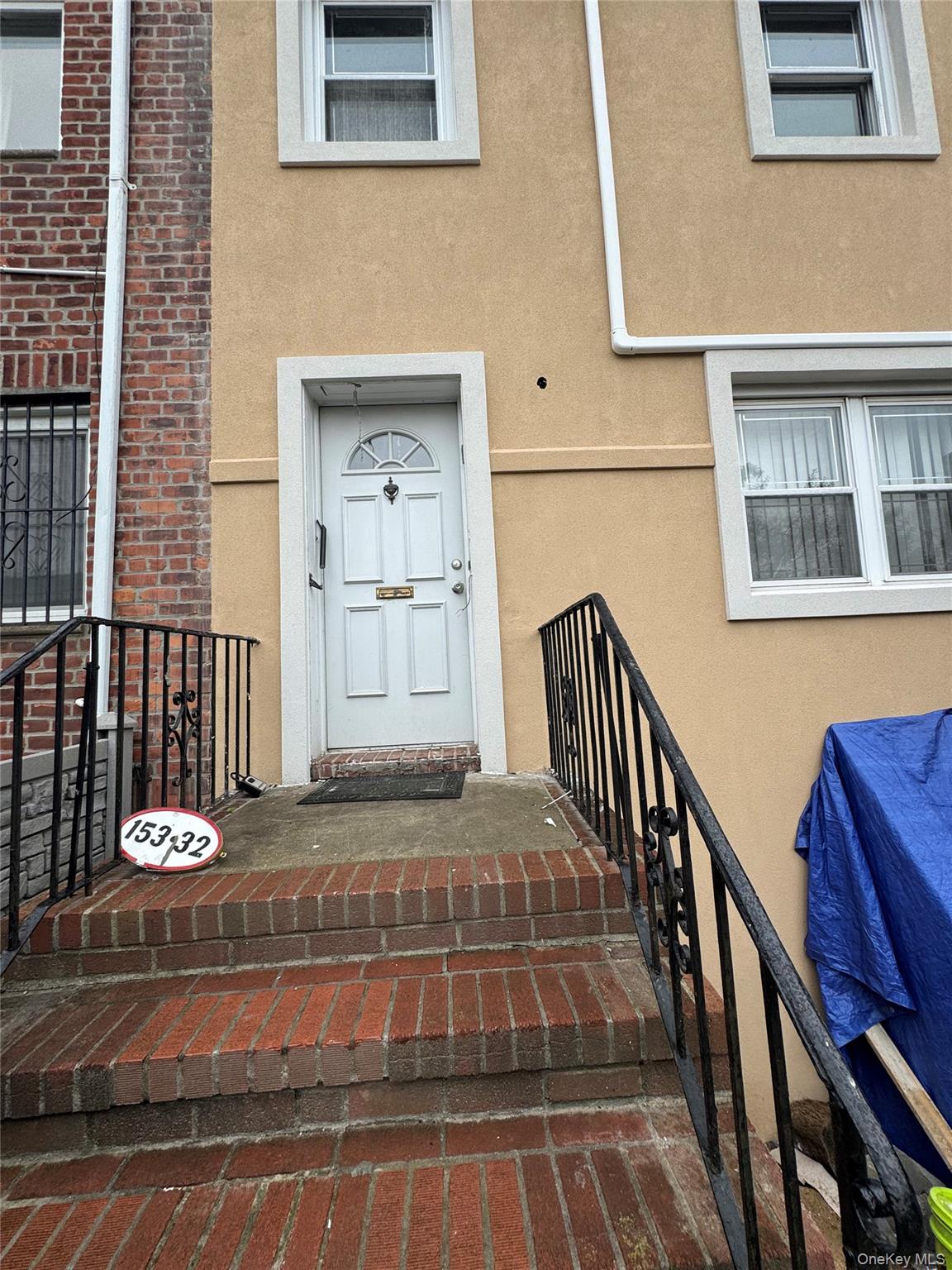 a view of staircase with white walls