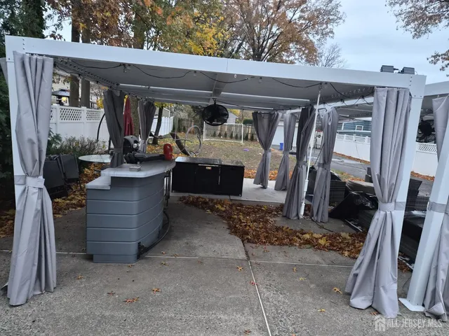 a view of sitting area with furniture and wooden deck