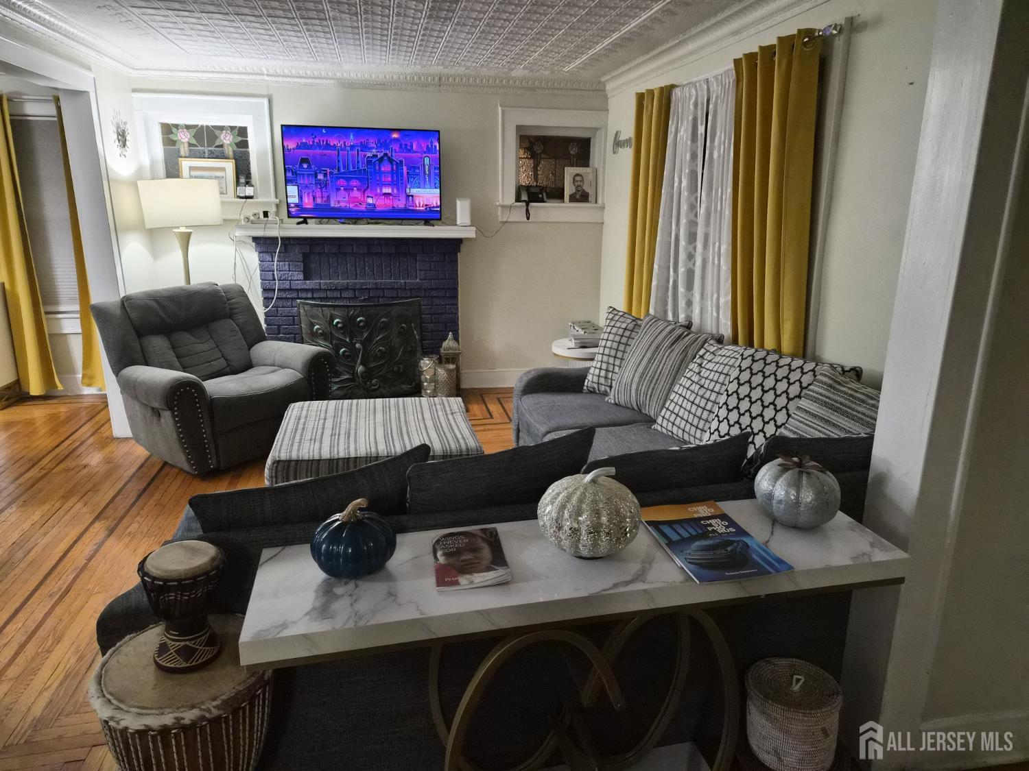 95 Farragut Road North Plainfield, NJ 07060 - Photo 2 of 30 a living room with furniture and a flat screen tv