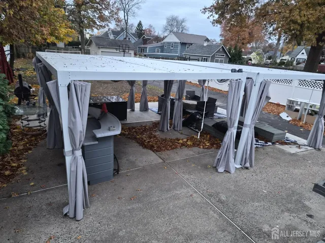 a view of a patio with table and chairs