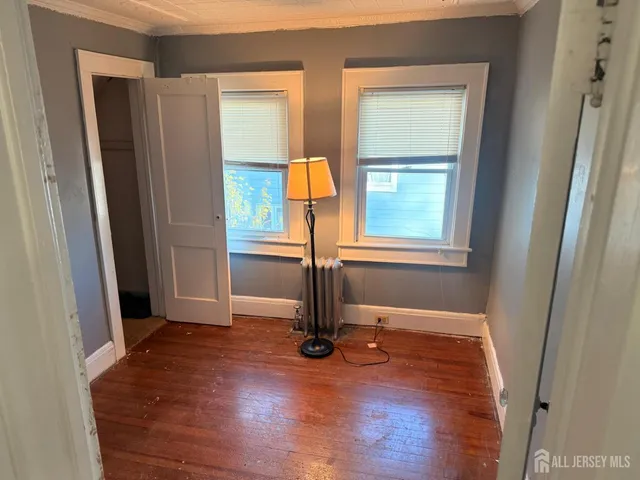 a view of front door with wooden floor
