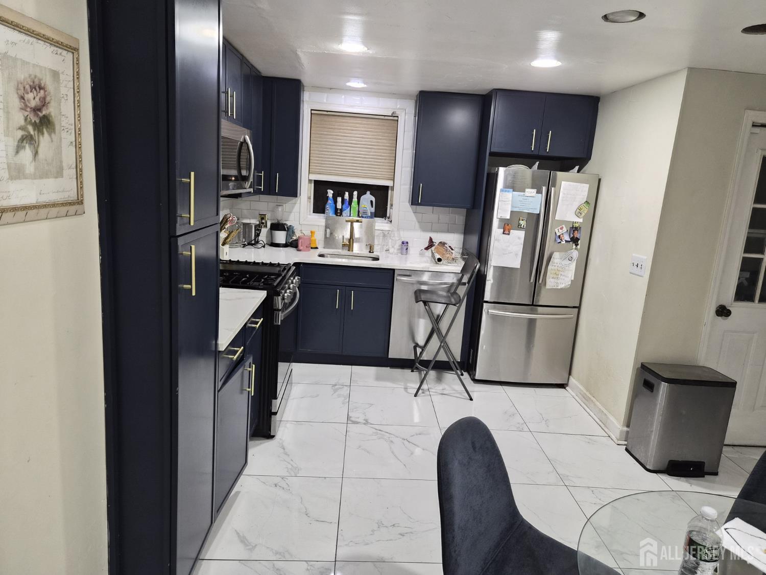 95 Farragut Road North Plainfield, NJ 07060 - Photo 6 of 30 a kitchen with stainless steel appliances a refrigerator sink and microwave