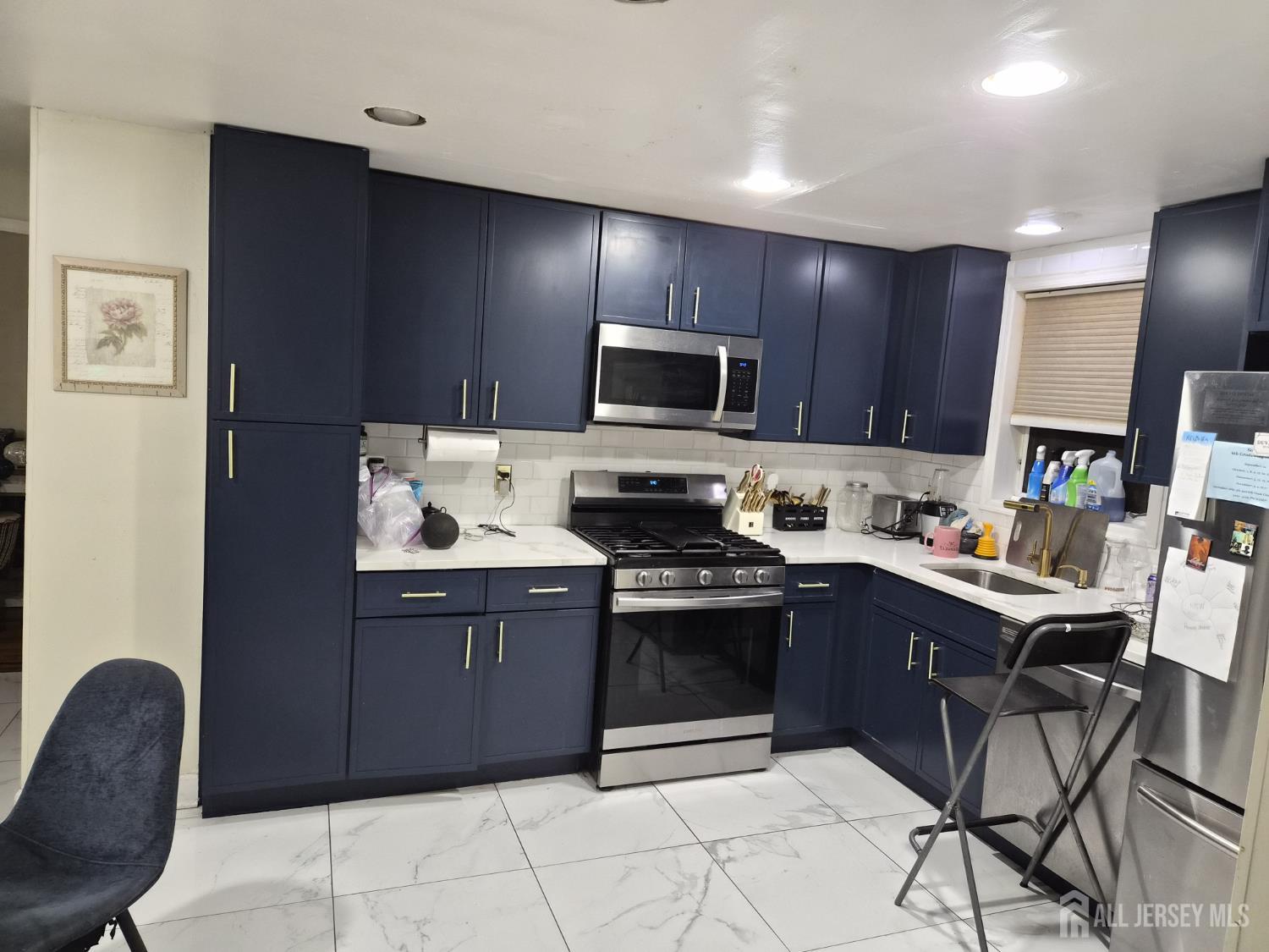 95 Farragut Road North Plainfield, NJ 07060 - Photo 7 of 30 a kitchen with stainless steel appliances granite countertop a stove top oven a sink dishwasher and a refrigerator
