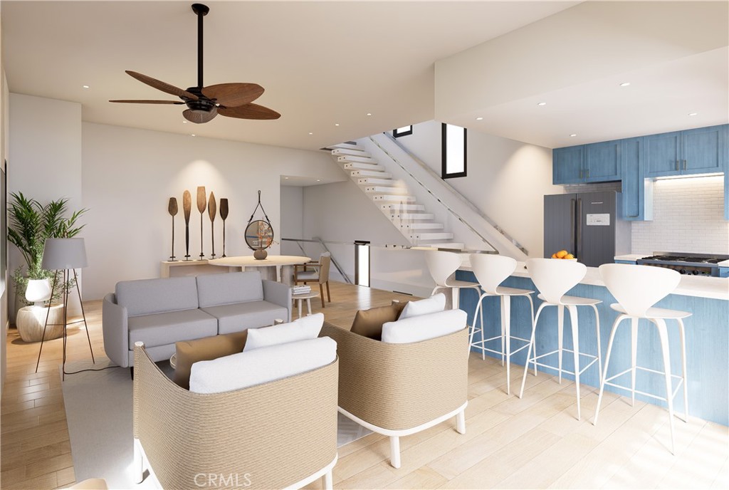 a living room with lots of furniture and a chandelier