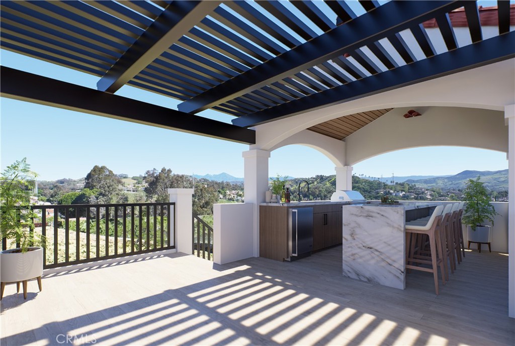 31302 Andres Pico Road San Juan Capistrano, CA 92675 - Photo 11 of 33 a view of a balcony with furniture and floor to ceiling window