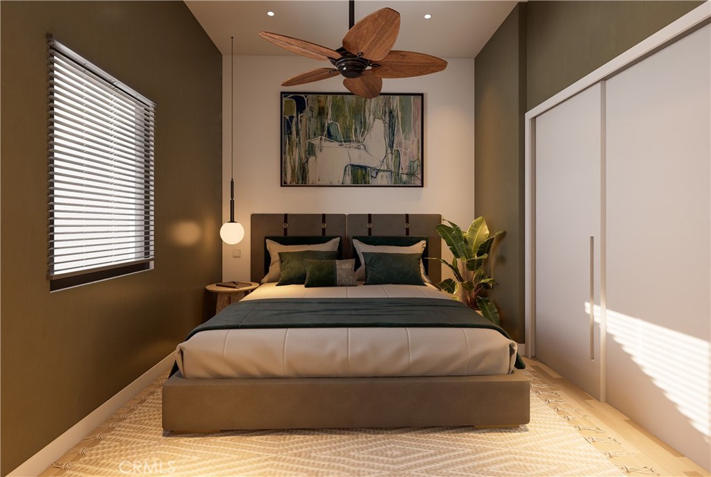 31302 Andres Pico Road San Juan Capistrano, CA 92675 - Photo 16 of 33 a bedroom with a bed and wooden floor