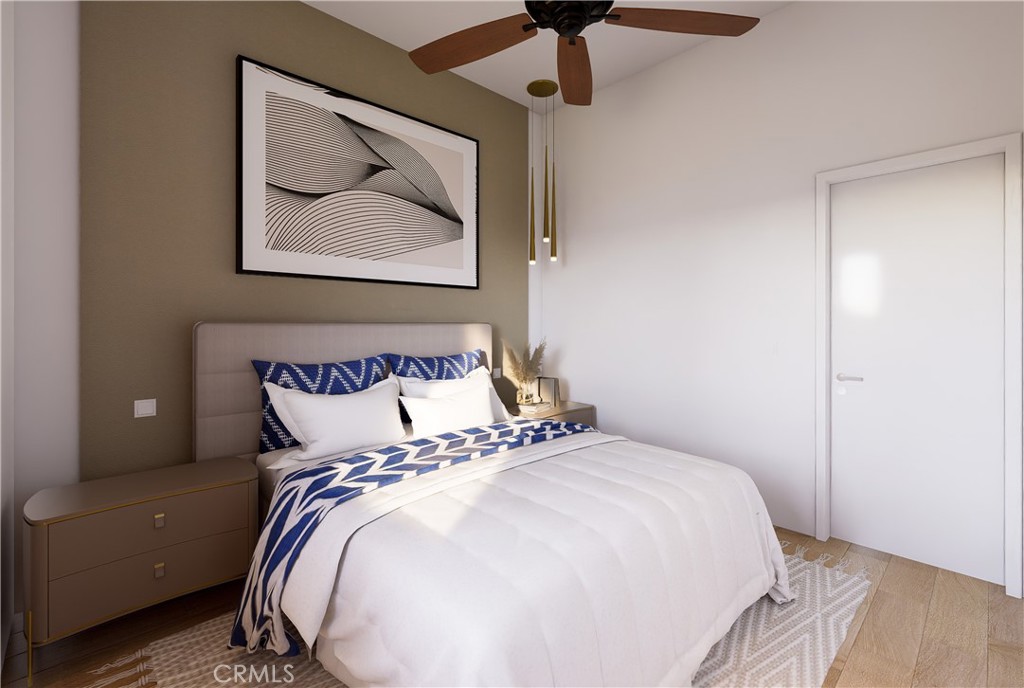31302 Andres Pico Road San Juan Capistrano, CA 92675 - Photo 22 of 33 a bedroom with a bed and a painting on the wall