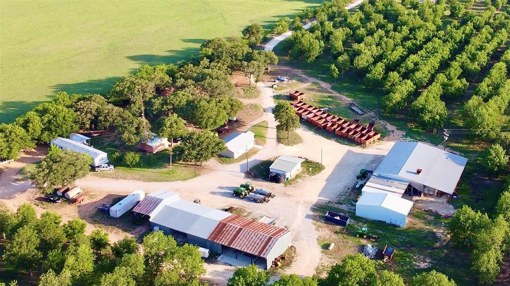 751 County Road 424 Comanche, TX 76442 - Photo 8 of 26 an aerial view of residential house with outdoor space and trees all around
