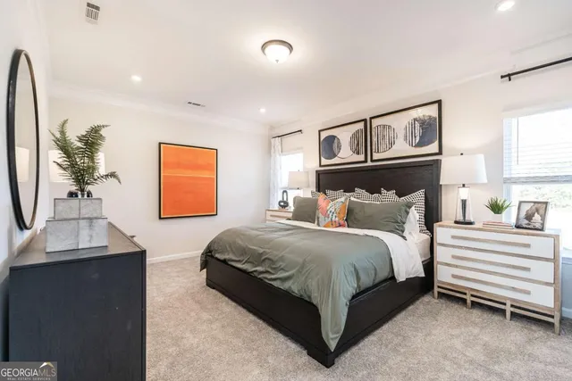 a bedroom with a bed and a table