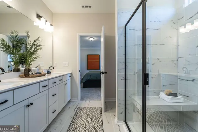 a spacious bathroom with a shower and a sink