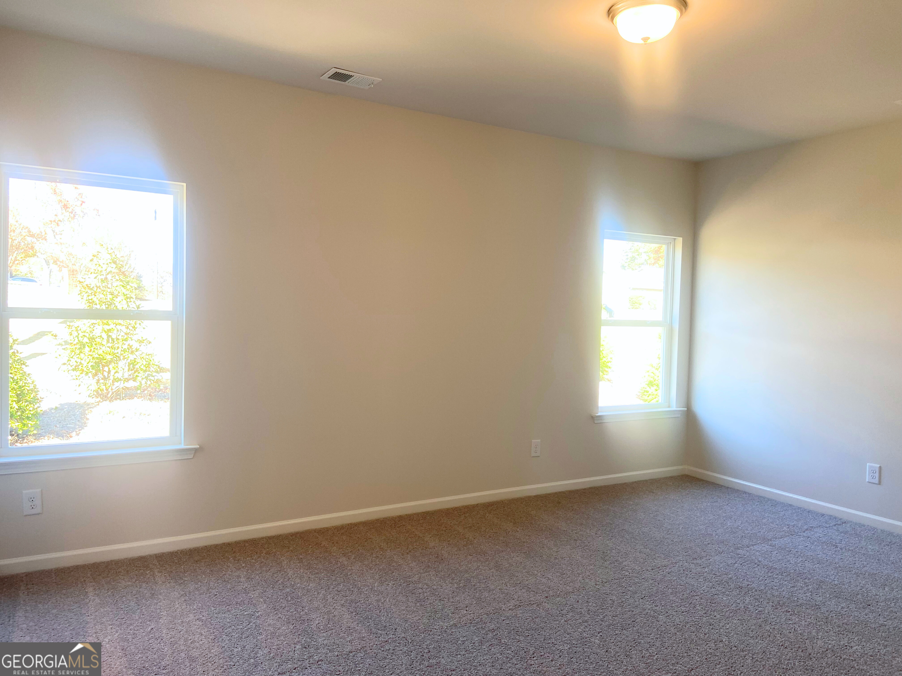 10413 Trellis Lane, Unit (LOT 33) Hampton, GA 30228 - Photo 6 of 39 an empty room with a window