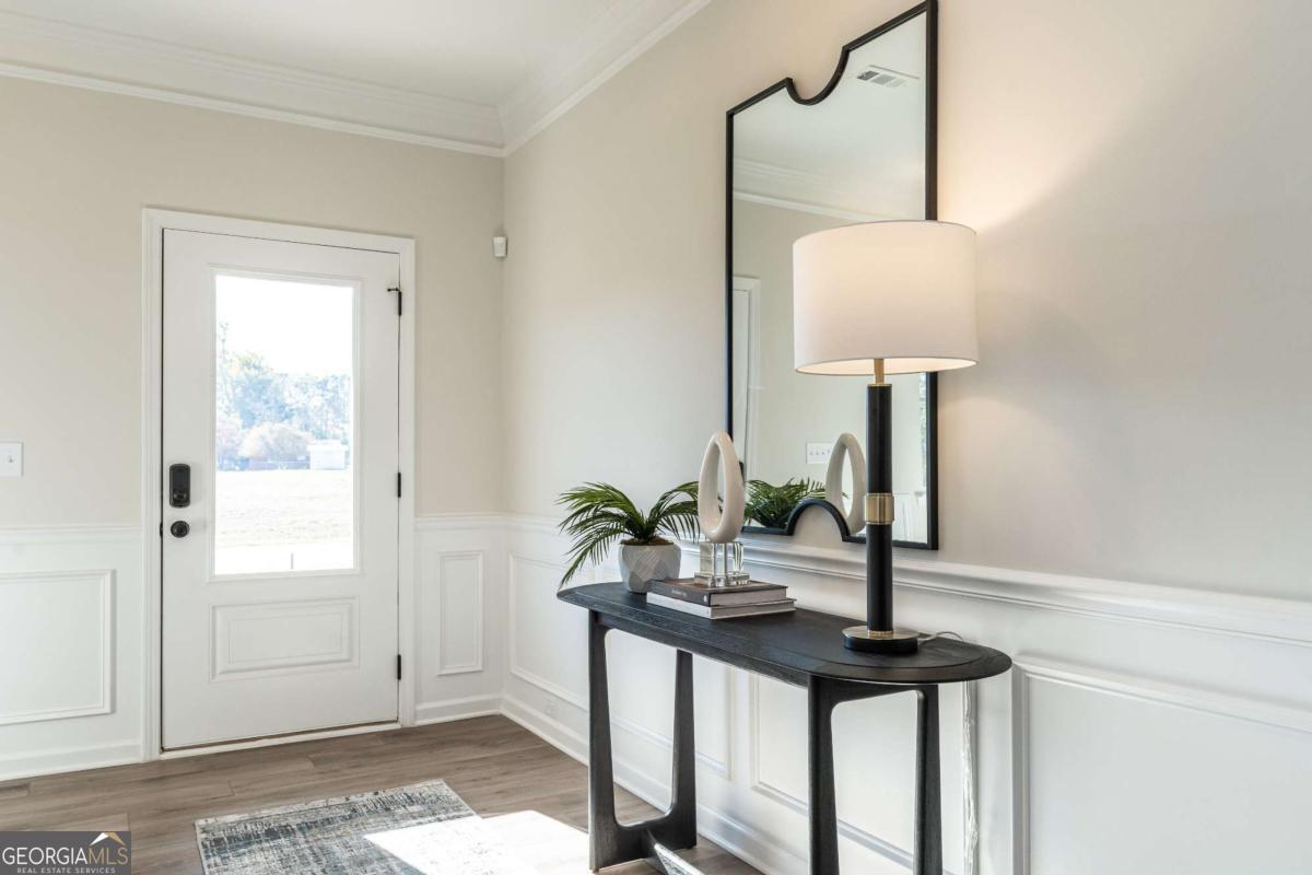 10413 Trellis Lane, Unit (LOT 33) Hampton, GA 30228 - Photo 10 of 39 a view of entryway with a potted plant