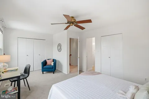 a bedroom with a bed and a chair