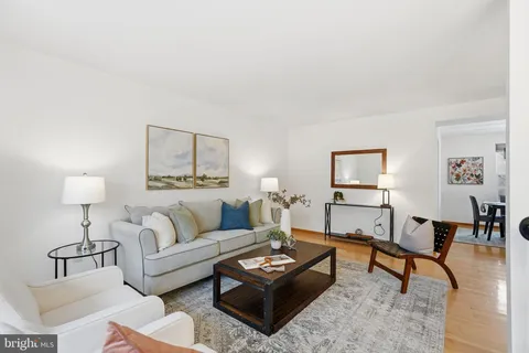 a living room with furniture and a table