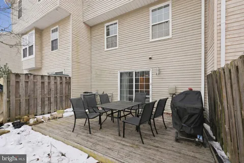 a view of a dinning table and chairs in the patio