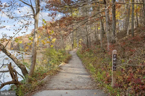 a view of pathway with a yard