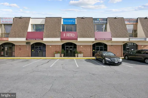 a view of building with parked cars