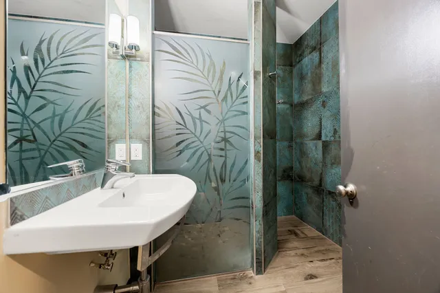 a bathroom with a sink and mirror