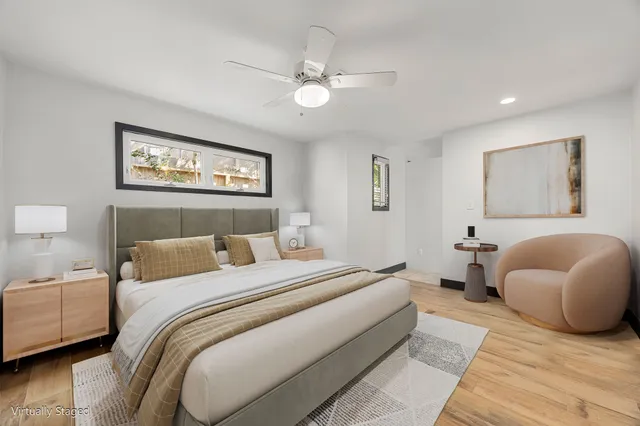 a bedroom with a large bed and a couch