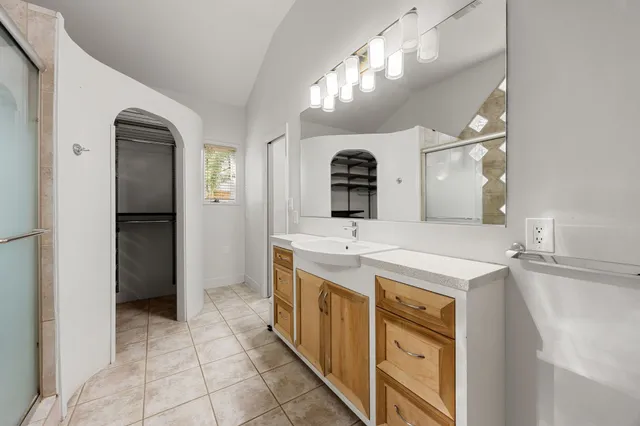 a kitchen with a sink and a refrigerator