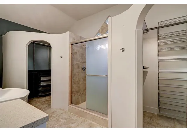 a bathroom with a shower and a toilet