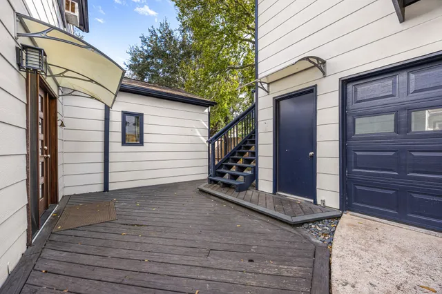 a view of a house with wooden fence