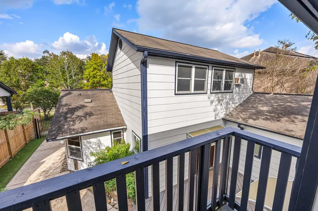a balcony view with a garden