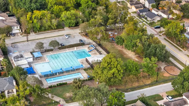 an aerial view of a house with a swimming pool