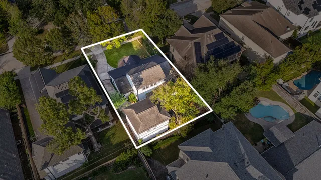 an aerial view of a house with a garden