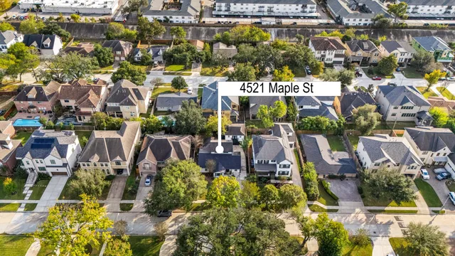 an aerial view of residential houses and outdoor space