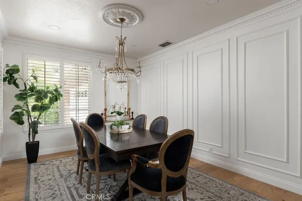 a view of a dining room with furniture and window