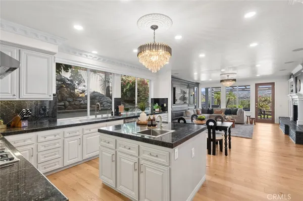 a kitchen with counter top space and dining table
