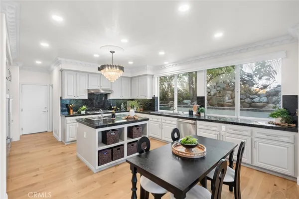 a kitchen with a table and chairs in it