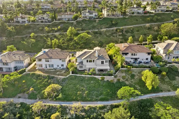 an aerial view of a house with a lake view