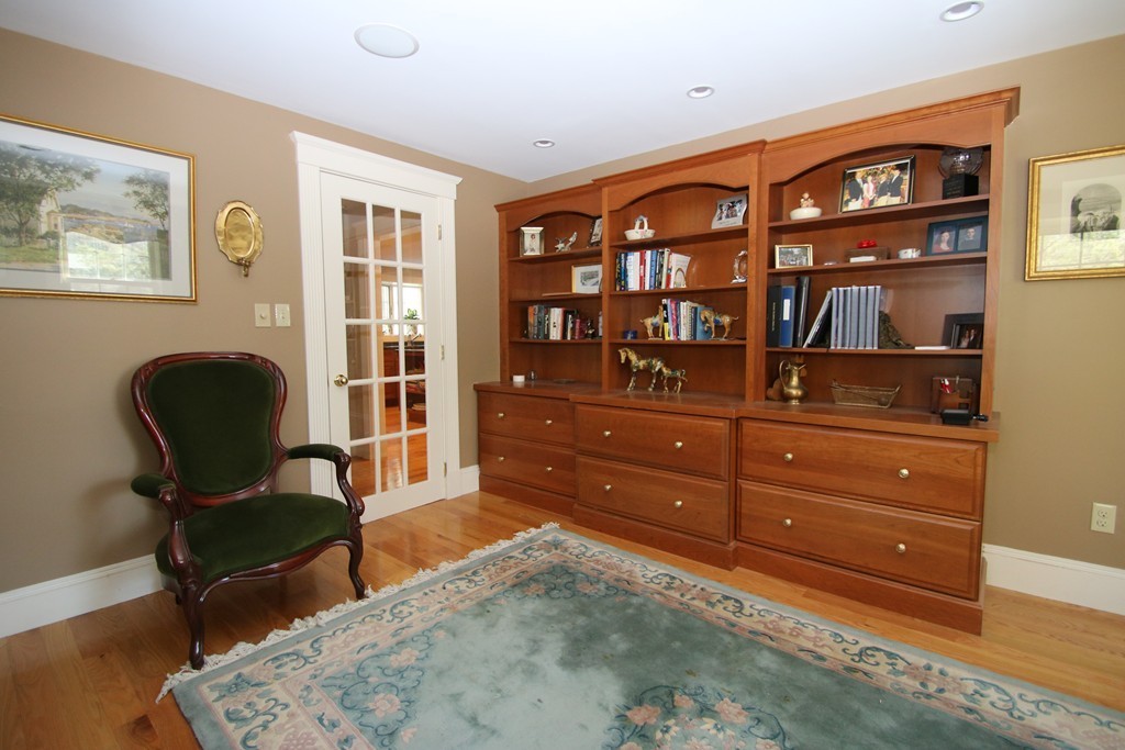 165 Herrick Road Boxford, MA 01921 - Photo 11 of 30 a workspace with wooden floor and furniture