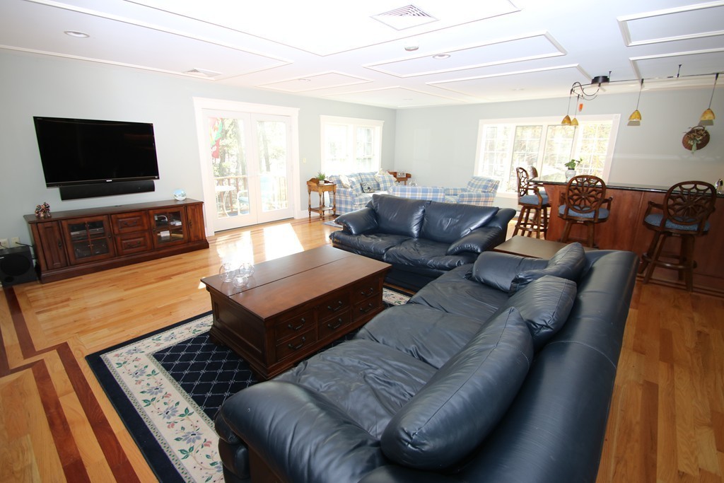 165 Herrick Road Boxford, MA 01921 - Photo 12 of 30 a living room with furniture and a flat screen tv